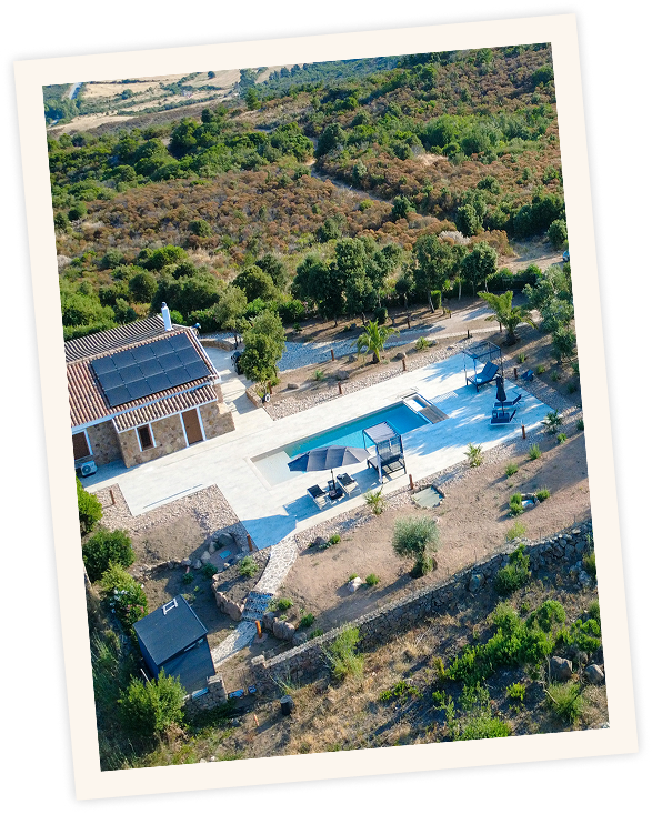 Stone villa exterior with pool